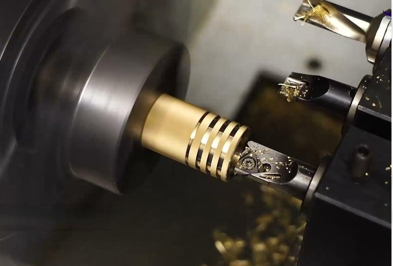 Precision machining of brass threaded inserts for plumbing components